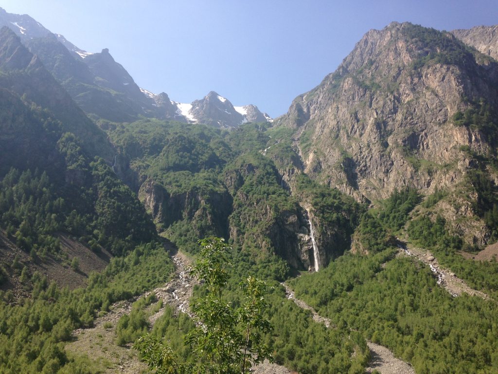 French Alps view when on the famous road cycling climb to les deux alpes. Mountains and waterfalls.