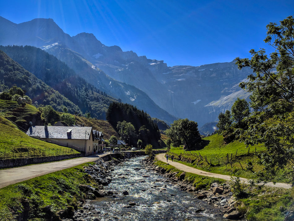 Looking up towards Cirque de Gavarnie in the Pyrenees with a mountain stream in the foreground