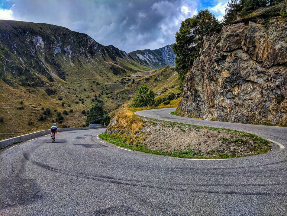 A cyclist on a switchback descending from Luz Ardiden in the Pyrenees
