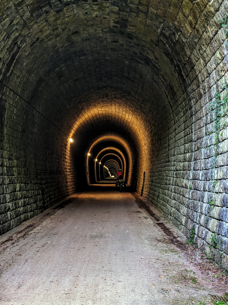 A cyclist in the tunnel near Rimont on the Saint-Girons to Foix Voie Verte rail trail