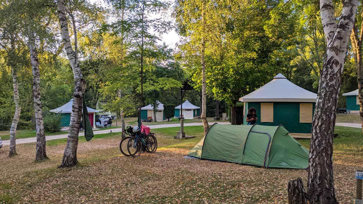 A campsite with tent and bicycles