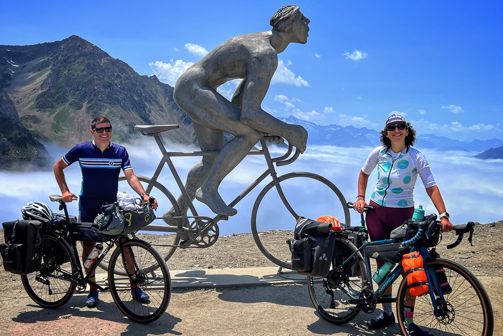 Bella and Steve from Seek Travel Ride at the top of Col du Tourmalet while cycle touring across the Pyrenees