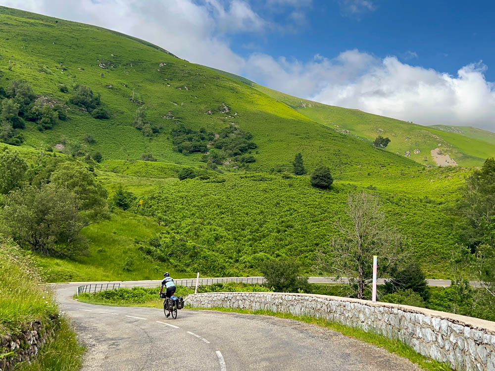 Stephen from Seek Travel Ride descending the col de Jau while cycle touring across the Pyrenees