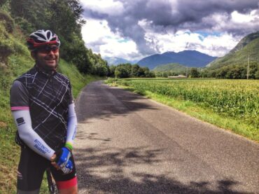 cycling around Lourdes in the French Pyrenees by lush wheatfields