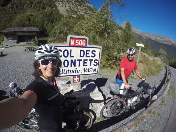 Two cyclists at the summit of the Col des Montets