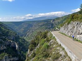A cyclist riding along the stunning balcony road of the Gorges de la Nesque
