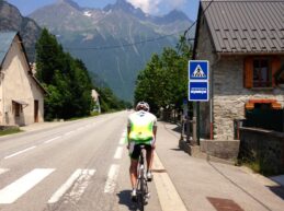 A male cyclist at the beginning of the ride to Alpe d'Huez in the French Alps