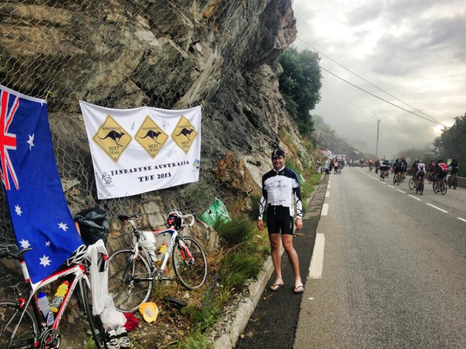 Fans lining the road with banners on the TDF Alpe d'Huez stage